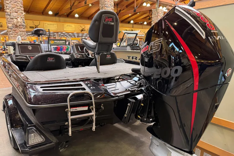 Slide: The Image of 2026 Ranger Z518 boat with powerful engine displayed indoors. - 8