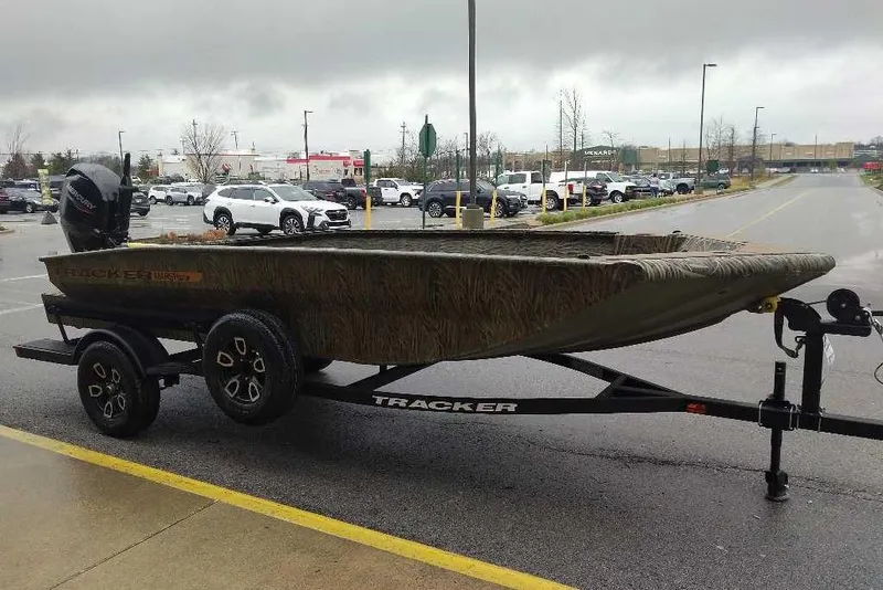 Slide: The Image of 2026 Tracker Grizzly 1756 T Marsh boat on trailer in parking lot. - 52