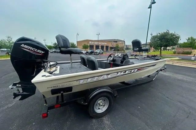 Slide: The Image of 2026 Tracker Pro 170 fishing boat with Mercury engine in parking lot. - 3