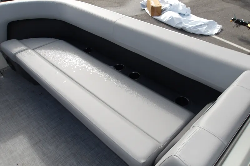 Slide: The Image of 2026 Sun Tracker Party Barge 18 DLX with gray seating and cup holders. - 14