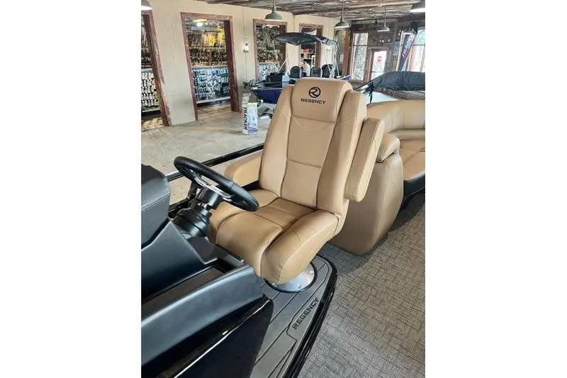 Slide: The Image of Luxurious 2026 Regency 230 DL boat captain's chair in showroom setting. - 9