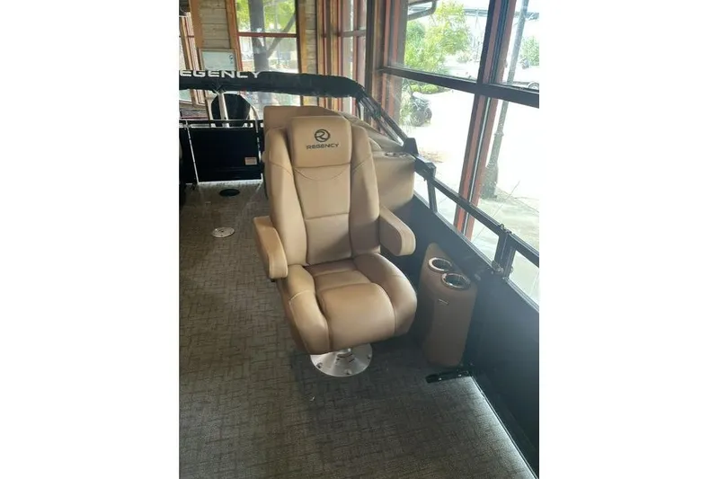 Slide: The Image of Luxurious beige captain's chair in 2026 Regency 230 DL boat interior. - 7