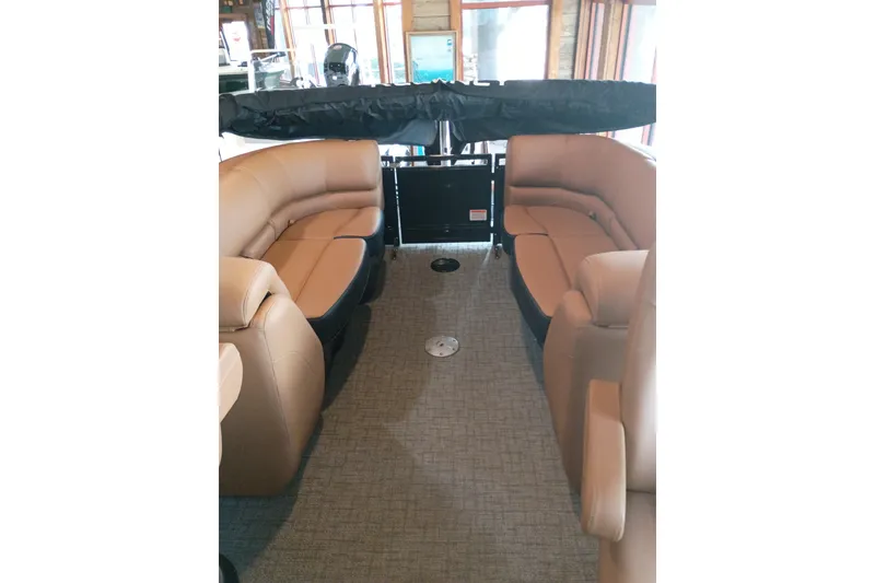 Slide: The Image of Luxurious interior of 2026 Regency 230 DL pontoon boat with plush seating. - 2