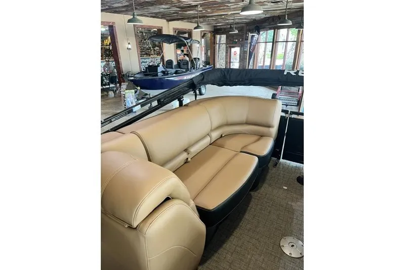 Slide: The Image of Luxurious interior of 2026 Regency 230 DL boat with tan leather seating. - 10
