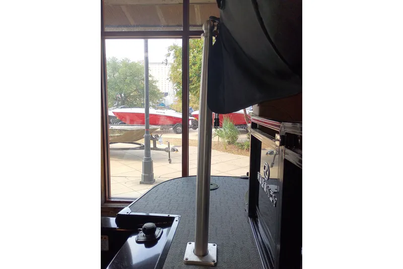 Slide: The Image of 2026 Regency 230 DL boat interior with outdoor view through window. - 7