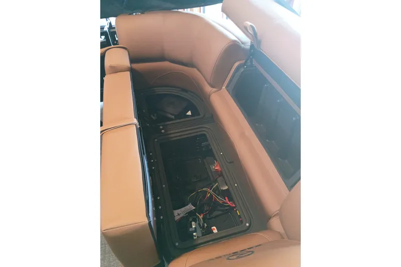 Slide: The Image of 2026 Regency 230 DL boat interior showing under-seat storage and wiring. - 12