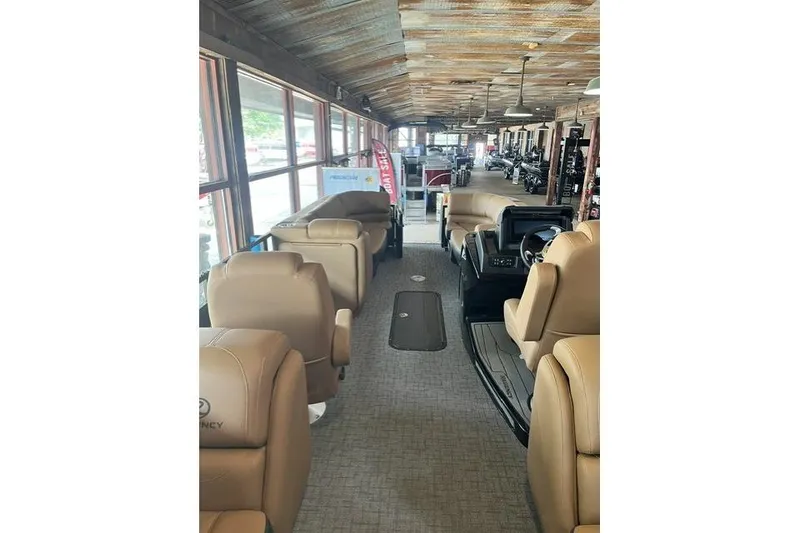 Slide: The Image of 2026 Regency 230 DL boat interior with luxurious seating and modern design. - 12