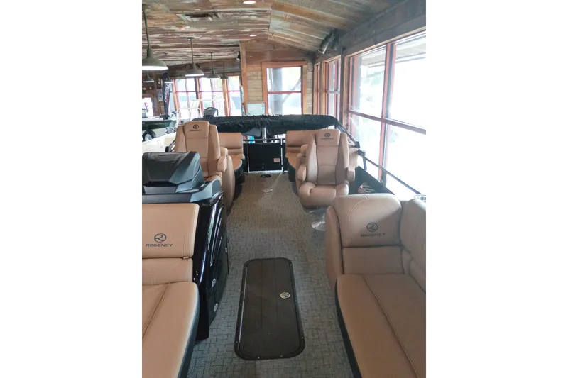 Slide: The Image of Luxurious interior of 2026 Regency 230 DL pontoon boat with plush seating and modern design. - 11