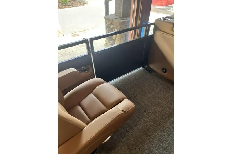 Slide: The Image of Luxurious interior of 2026 Regency 230 DL with plush seating and modern design. - 13