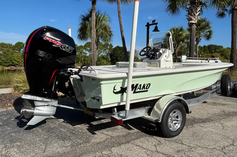 Slide: The Image of 2026 Mako 18 Pro Skiff boat with Mercury Pro XS engine on trailer. - 1