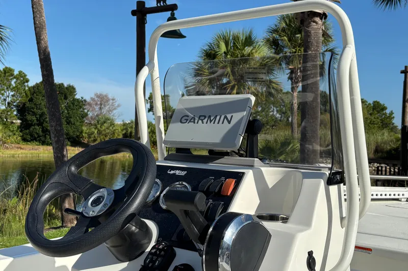 Slide: The Image of 2026 Mako 18 Pro Skiff boat dashboard with Garmin navigation system. - 7