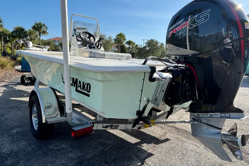 Slide: The Image of 2026 Mako 18 Pro Skiff boat with Mercury Pro XS engine on trailer. - 2