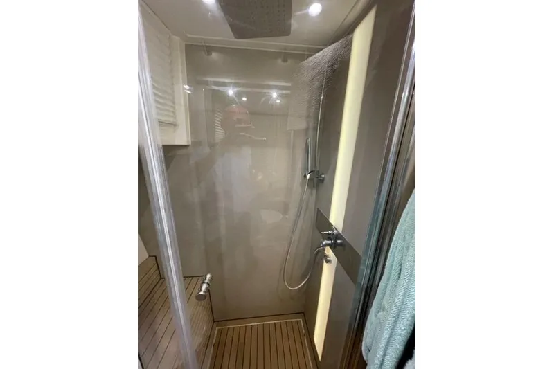 Slide: The Image of Modern shower area in 2022 Greenline 45 Fly yacht with sleek design and wooden flooring. - 10