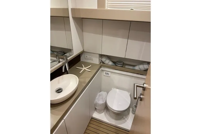 Slide: The Image of Modern bathroom interior on 2022 Greenline 45 Fly yacht, featuring sleek fixtures and wooden flooring. - 15