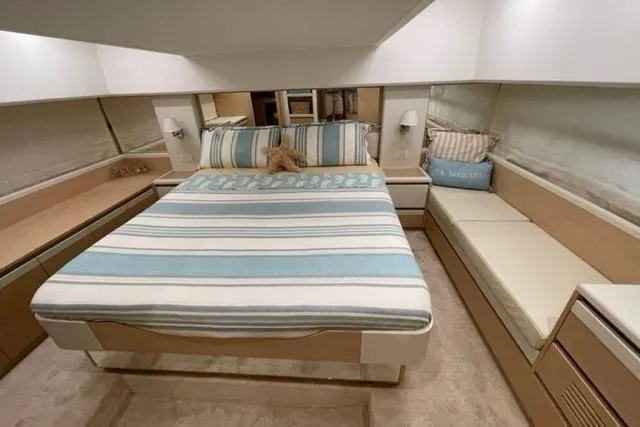 Slide: The Image of Luxurious bedroom interior of 2022 Greenline 45 Fly yacht with striped bedding. - 7