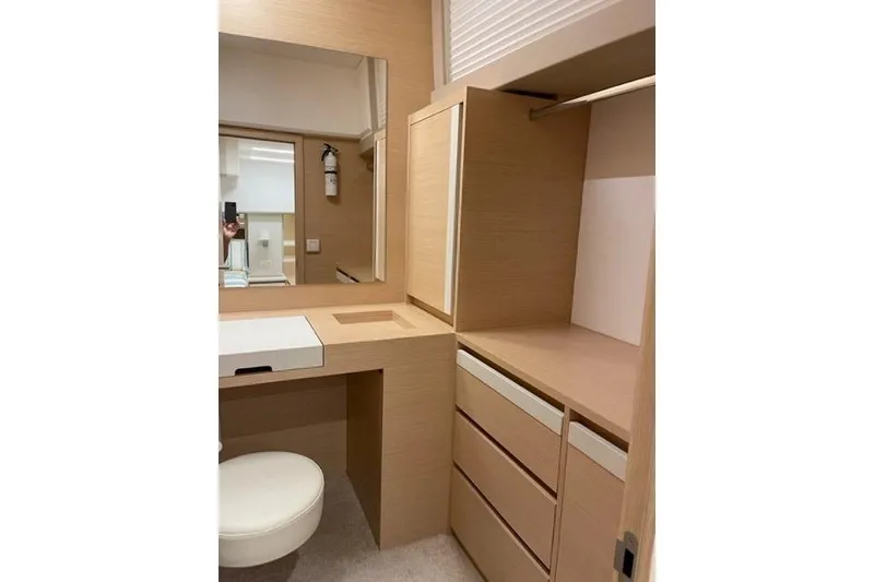 Slide: The Image of Modern vanity area in 2022 Greenline 45 Fly yacht with mirror and storage. - 8