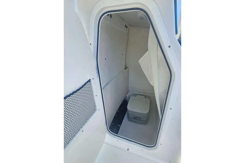 Slide: The Image of 2017 Sea Hunt BX 22 BR boat interior storage compartment with cooler. - 14