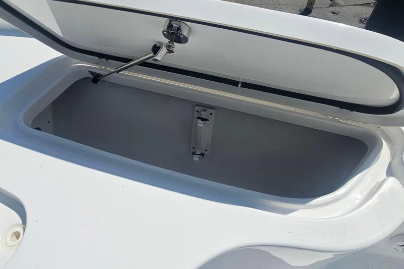 Slide: The Image of Open storage compartment on a 2017 Sea Hunt BX 22 BR boat. - 18