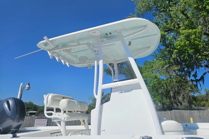 Slide: The Image of 2017 Sea Hunt BX 22 BR boat with T-top under clear blue sky. - 3