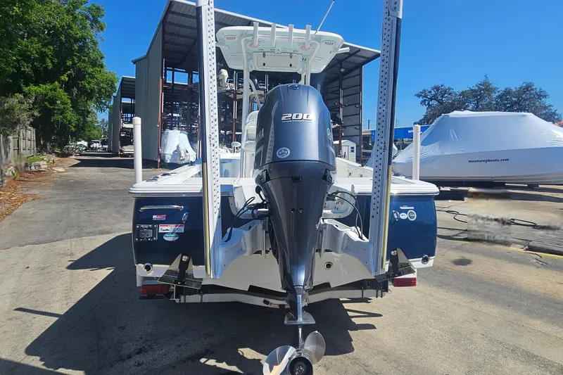 Slide: The Image of 2017 Sea Hunt BX 22 BR boat with Yamaha 200 engine, docked outdoors. - 4