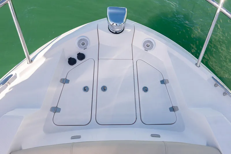 Slide: The Image of Manufacturer Provided Image: Bow of 2026 Regal 38 FXO boat with storage compartments and speakers. - 10