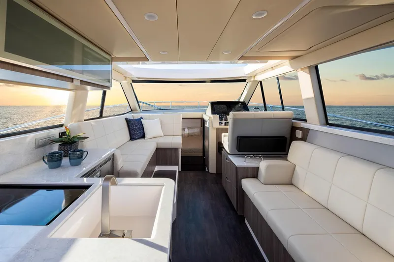 Slide: The Image of Manufacturer Provided Image: Luxurious interior of 2026 Regal 38 FXO yacht with modern seating and ocean view. - 17