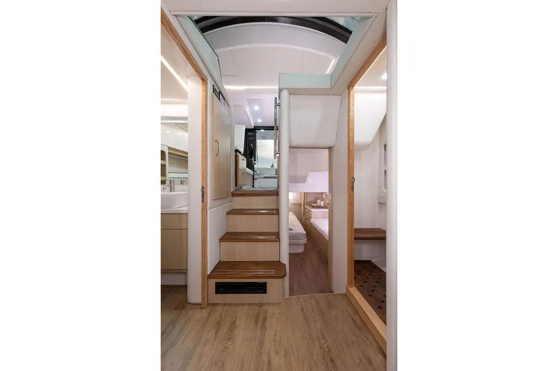 Slide: The Image of Manufacturer Provided Image: Interior of 2026 Regal 38 FXO yacht, featuring wooden stairs and modern design elements. - 19