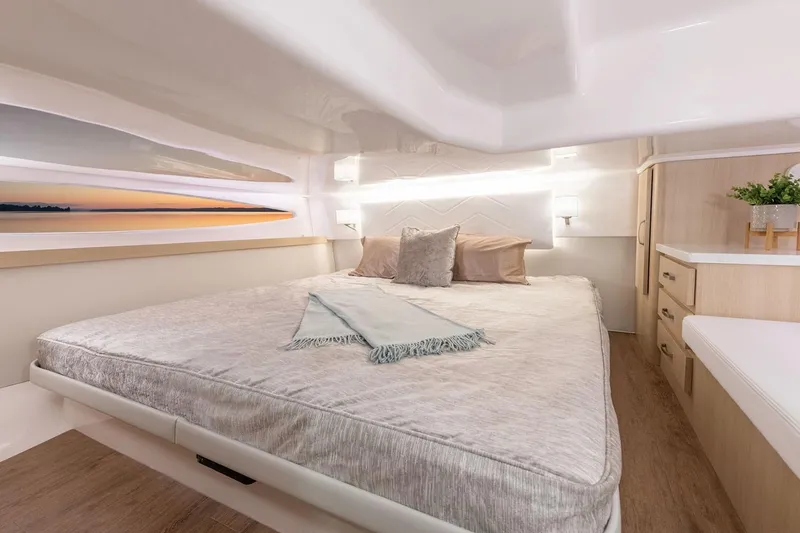Slide: The Image of Manufacturer Provided Image: Luxurious cabin interior of 2026 Regal 38 FXO yacht with cozy bed and modern decor. - 21