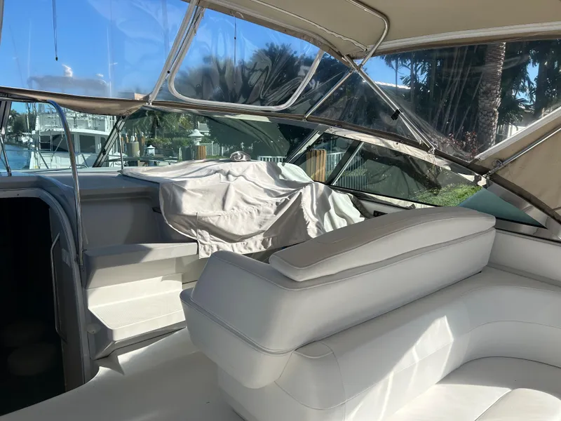 Slide: The Image of 2001 Formula 41 PC yacht interior with white seating and covered helm. - 13