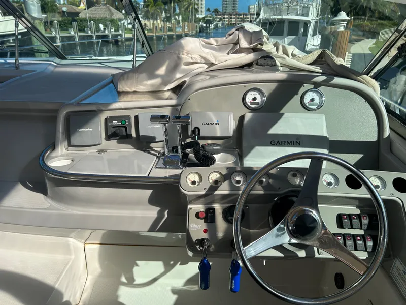 Slide: The Image of 2001 Formula 41 PC boat dashboard with Garmin navigation system and steering wheel. - 19