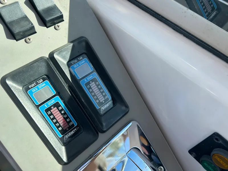 Slide: The Image of Control panel of a 2001 Formula 41 PC boat with trim indicators. - 24