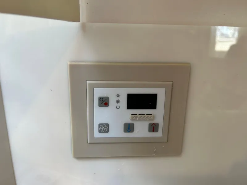 Slide: The Image of Control panel on a 2001 Formula 41 PC boat, featuring various function buttons. - 40