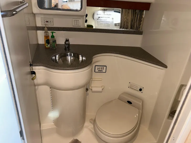 Slide: The Image of 2001 Formula 41 PC boat bathroom with sink, toilet, and countertop. - 41