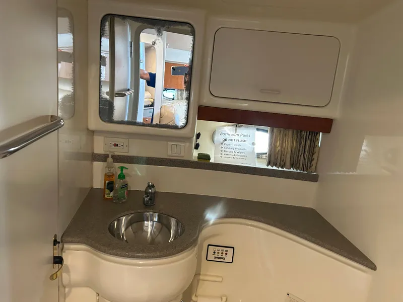 Slide: The Image of Interior of 2001 Formula 41 PC yacht bathroom with sink and mirror. - 44