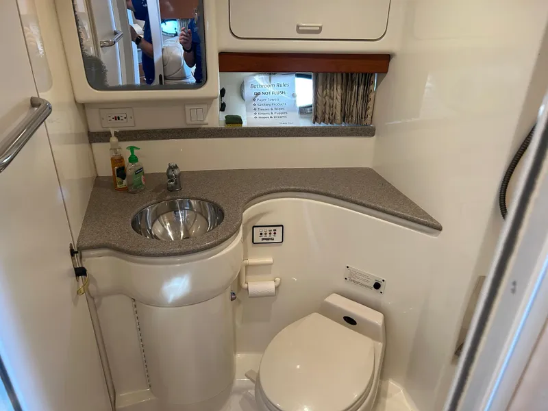 Slide: The Image of Bathroom in 2001 Formula 41 Performance Cruiser with sink and toilet. - 48