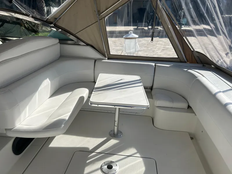 Slide: The Image of 2001 Formula 41 PC yacht interior with white seating and table. - 6