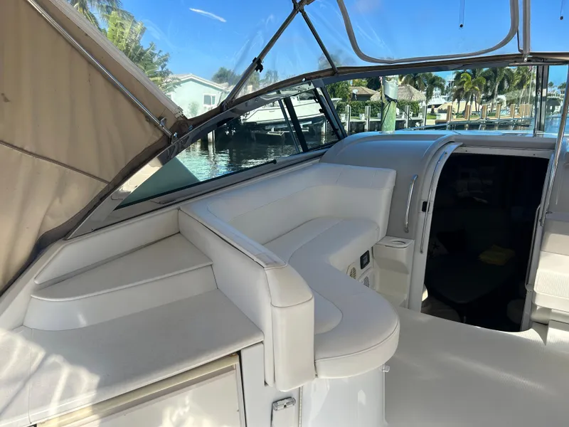 Slide: The Image of 2001 Formula 41 PC yacht interior with white seating and open cabin door. - 9
