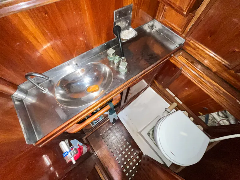 Slide: The Image of Interior of a 1984 Frers F&C 44 yacht with sink and toilet. - 14