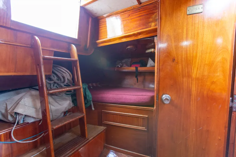 Slide: The Image of Interior of a 1984 Frers F&C 44 yacht with wooden finish. - 8