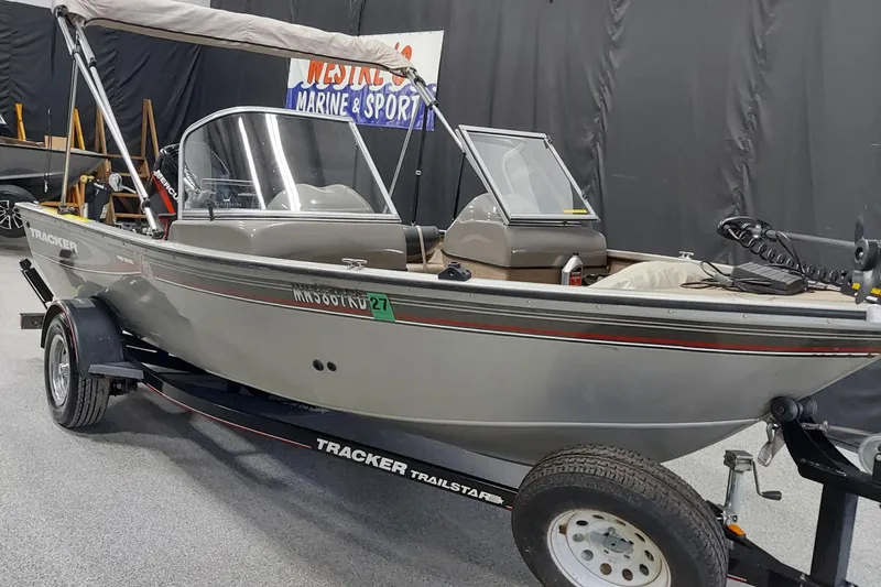 The Image of 2006 Tracker Pro Guide V-175 WT boat on trailer in showroom. - 1
