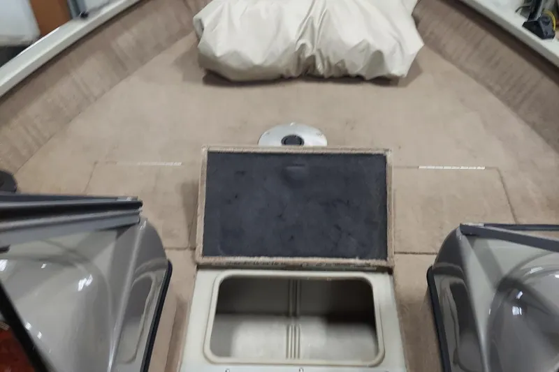 Slide: The Image of 2006 Tracker Pro Guide V-175 WT boat interior with storage compartments and seating area. - 6