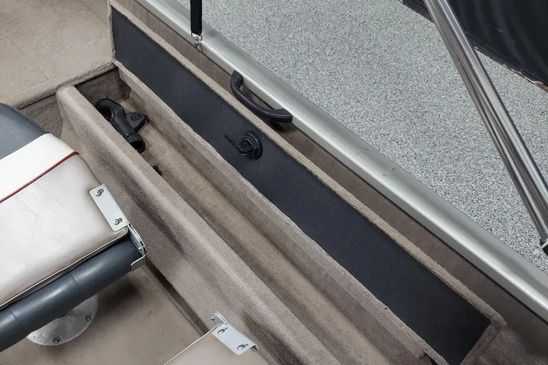 Slide: The Image of 2006 Tracker Pro Guide V-175 WT boat interior with seating and storage compartment. - 7