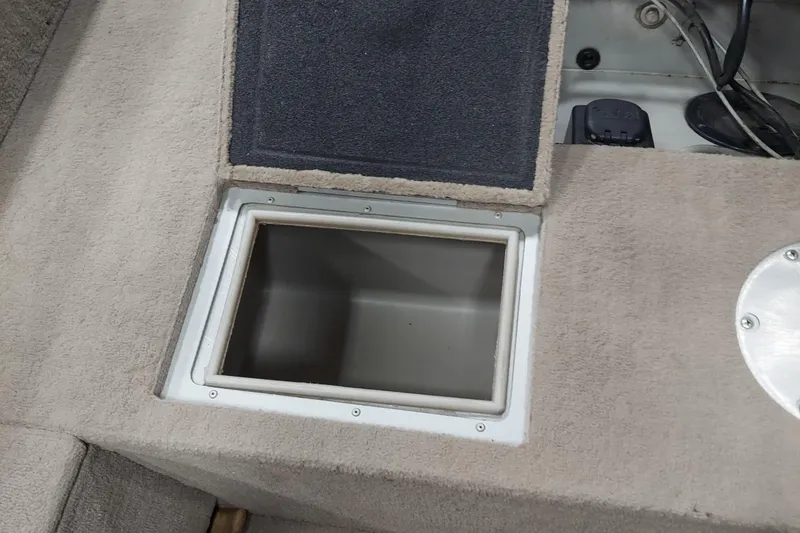 Slide: The Image of Open storage compartment on 2006 Tracker Pro Guide V-175 WT boat interior. - 8