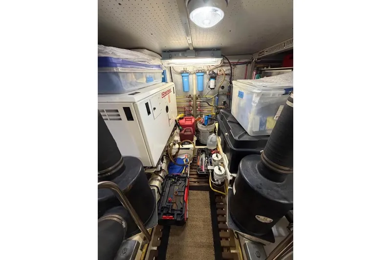 Slide: The Image of Luxurious kitchen interior of 2010 DeFever 48 Trawler with wooden cabinetry and modern appliances. - 11