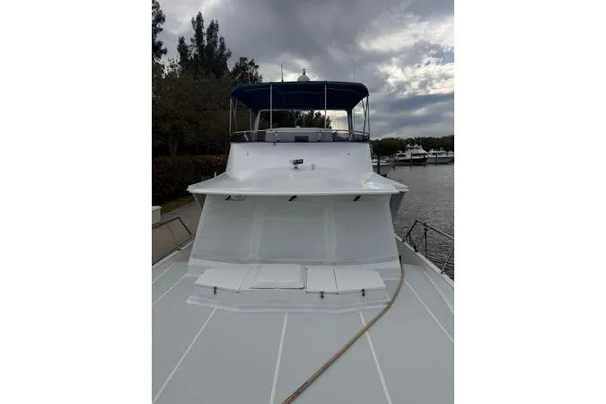 Slide: The Image of Interior of 2010 DeFever 48 Trawler with dining area and wooden furnishings. - 17