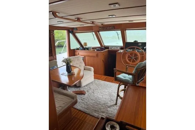Slide: The Image of Interior of a DeFever 48 Trawler yacht with dog and TV. - 2
