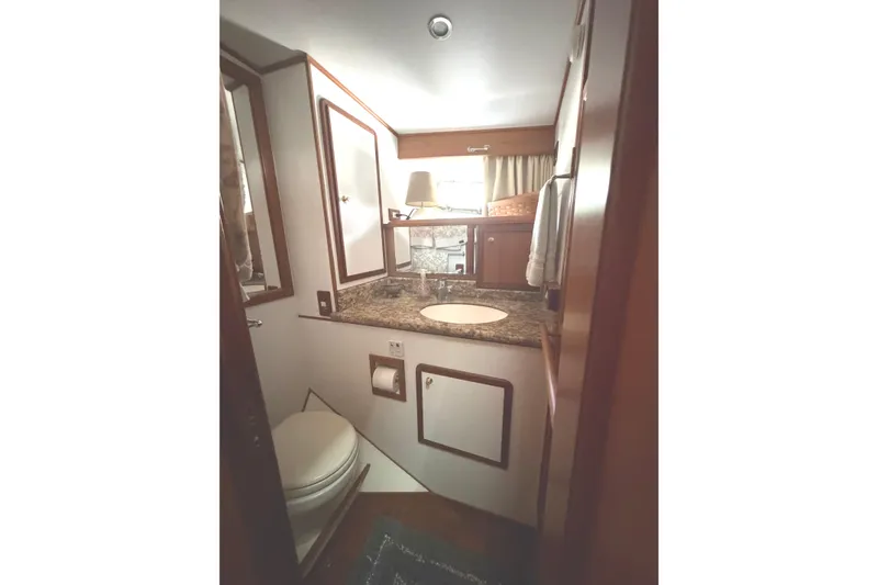 Slide: The Image of Interior of 2010 DeFever 48 Trawler bathroom with sink and toilet. - 23