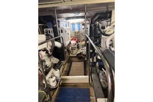 Slide: The Image of Engine room of a 2010 DeFever 48 Trawler, showcasing machinery and equipment. - 25