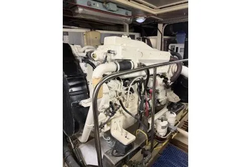 Slide: The Image of Engine room of 2010 DeFever 48 Trawler showcasing a powerful marine engine. - 27