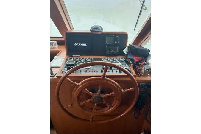 Slide: The Image of Wooden cabinetry and mini fridge in 2010 DeFever 48 Trawler interior. - 3